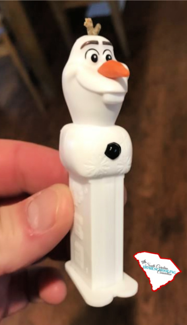 Next treasure hunt clue was hidden inside this Olaf Pez Dispenser